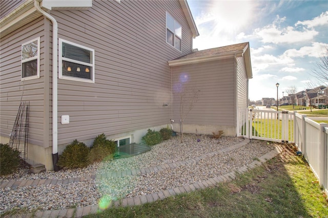 view of property exterior with fence