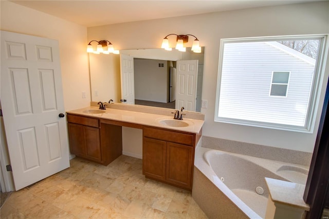 full bath featuring plenty of natural light, a sink, and double vanity