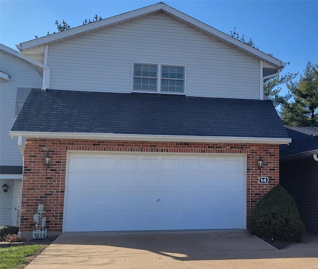 view of side of property featuring a garage