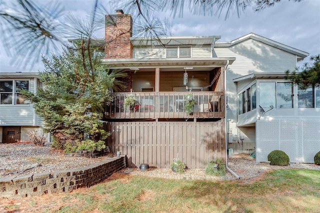 back of property with a balcony