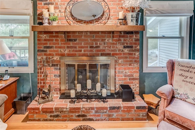 interior details with a brick fireplace