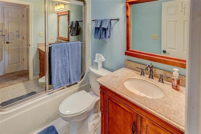 full bathroom with tile patterned flooring, vanity, toilet, and bath / shower combo with glass door