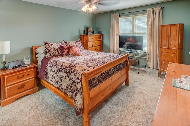 bedroom with light colored carpet and ceiling fan