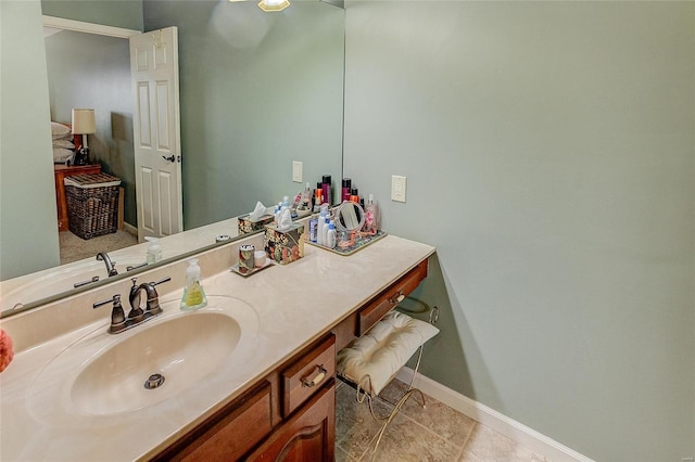 bathroom featuring tile patterned flooring and vanity