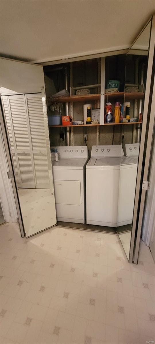 laundry room featuring washing machine and clothes dryer