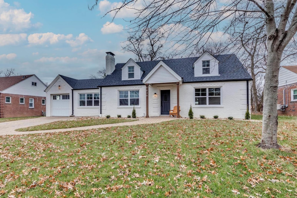 view of front facade with a front lawn and a garage