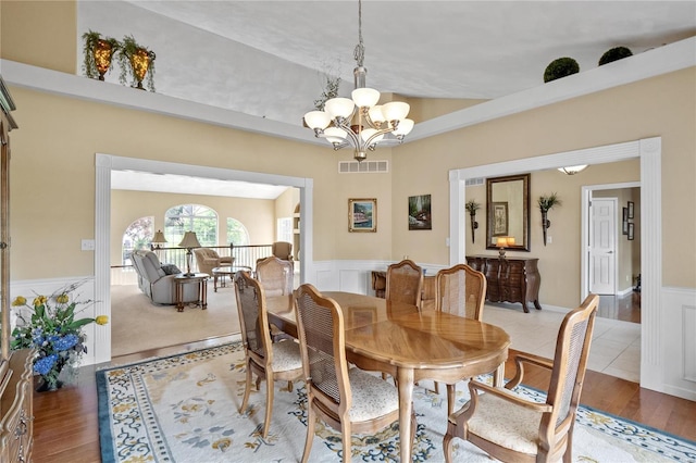 dining space with a chandelier and hardwood / wood-style flooring