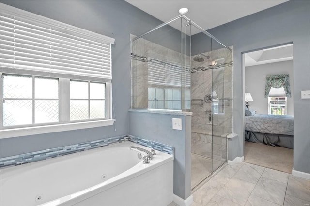 bathroom featuring separate shower and tub