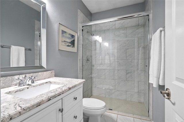 bathroom with vanity, toilet, and walk in shower