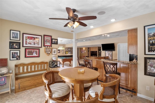 dining area featuring ceiling fan and billiards