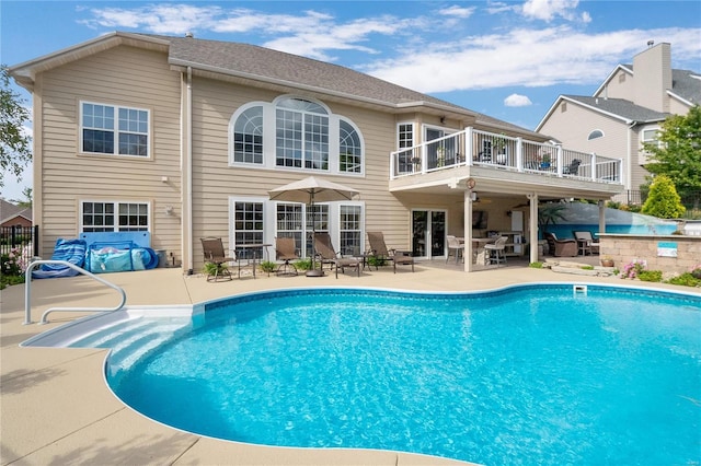 view of swimming pool featuring a patio area