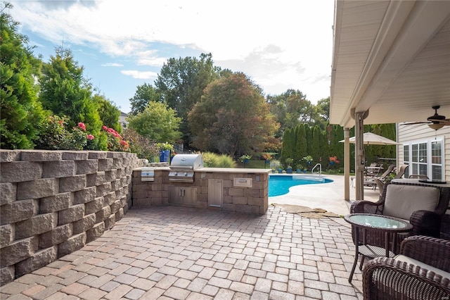 view of patio / terrace featuring area for grilling and ceiling fan