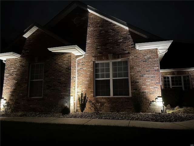 view of property exterior at night