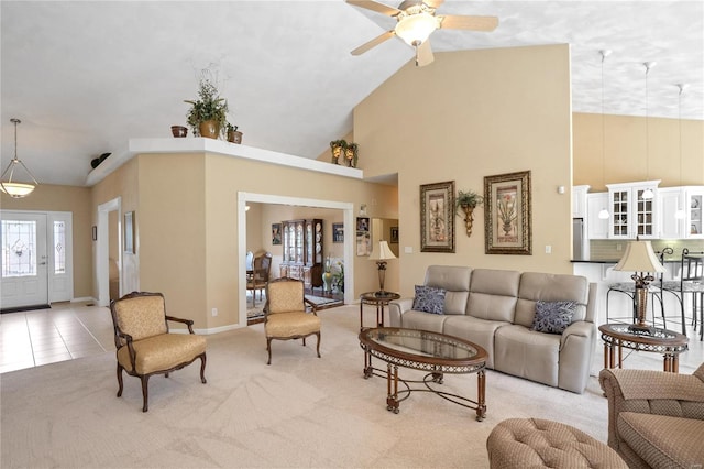 living room with ceiling fan, light tile patterned flooring, and high vaulted ceiling