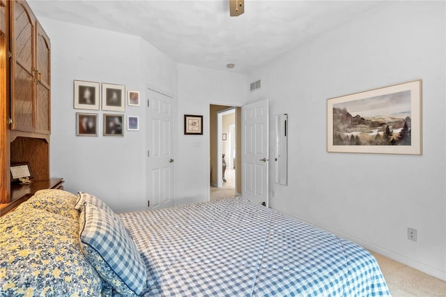 bedroom with light carpet and ceiling fan