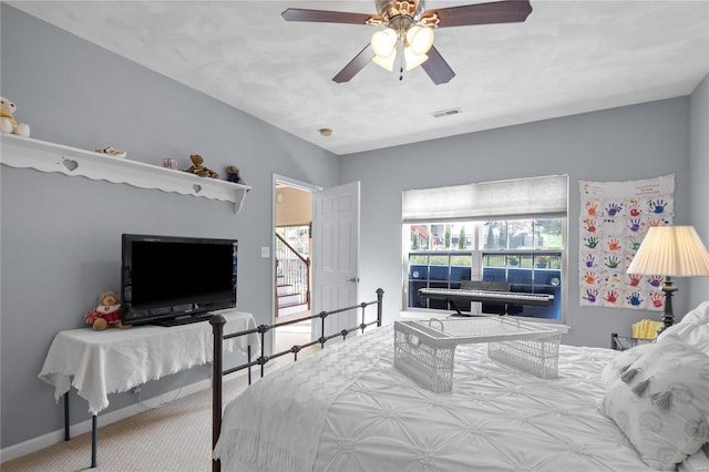 bedroom with ceiling fan and carpet