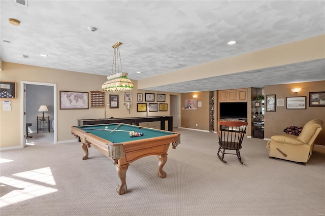 game room featuring a textured ceiling, light colored carpet, and billiards