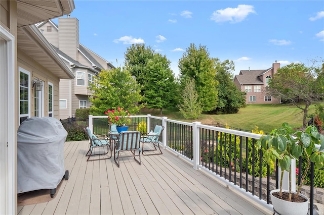 deck featuring a yard and area for grilling