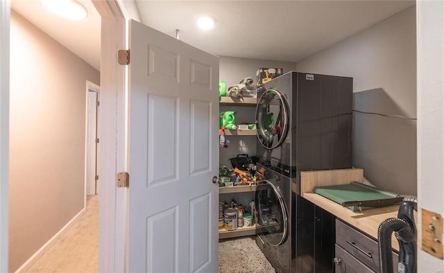 laundry room featuring stacked washer / dryer