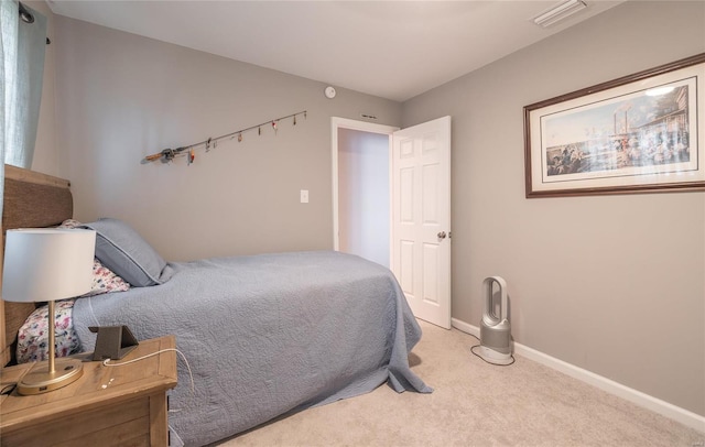 bedroom with light colored carpet