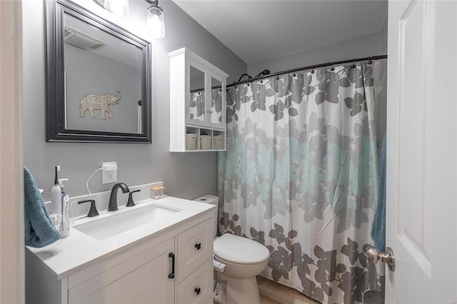 bathroom with toilet, hardwood / wood-style floors, vanity, and a shower with shower curtain