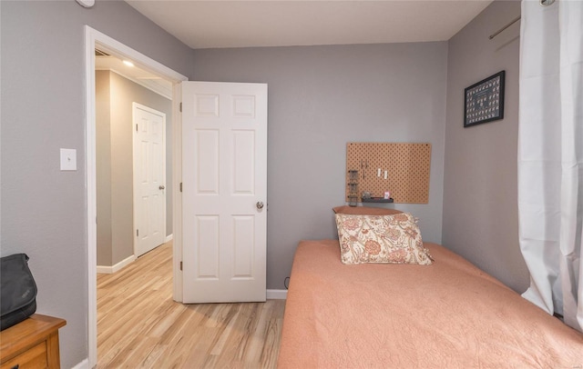 bedroom with light hardwood / wood-style flooring