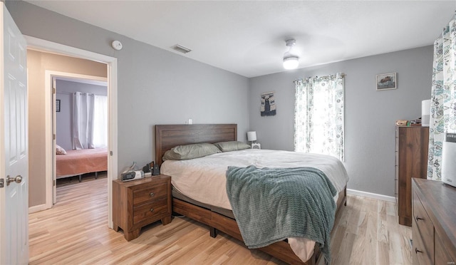 bedroom with light hardwood / wood-style floors