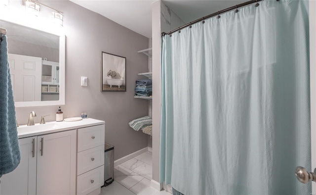 bathroom featuring vanity and curtained shower