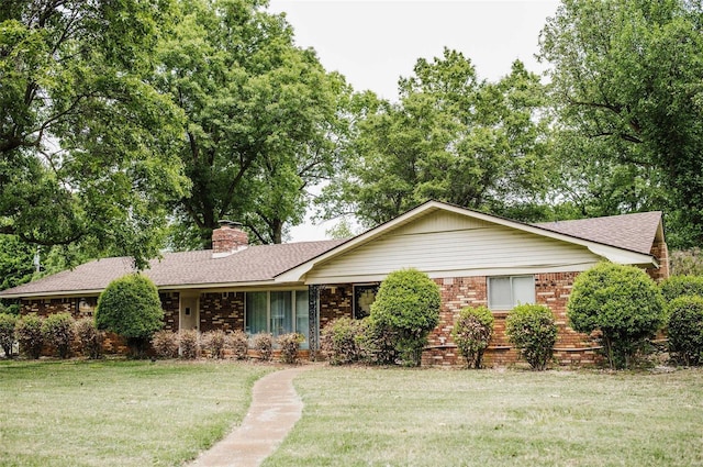 ranch-style home with a front yard