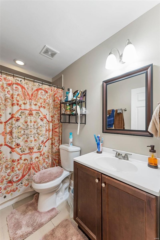 bathroom with tile patterned floors, vanity, a shower with shower curtain, and toilet