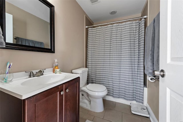 bathroom with tile patterned floors, vanity, and toilet