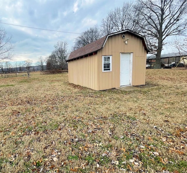 view of outbuilding with a lawn