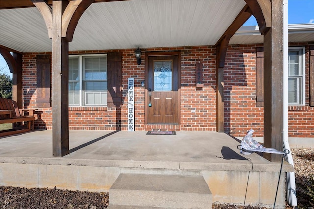 doorway to property with a porch