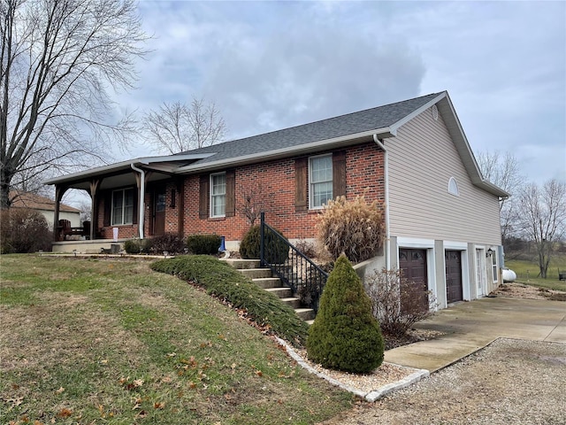 single story home with a porch, an attached garage, brick siding, concrete driveway, and a front yard