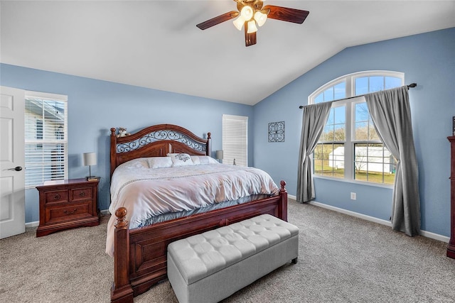 bedroom with vaulted ceiling, ceiling fan, carpet, and baseboards