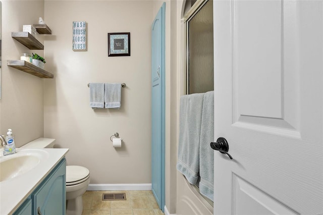 full bath featuring tile patterned flooring, toilet, vanity, visible vents, and baseboards