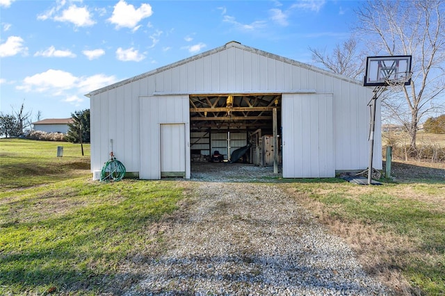 view of pole building with a yard