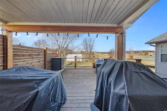 deck featuring fence and grilling area