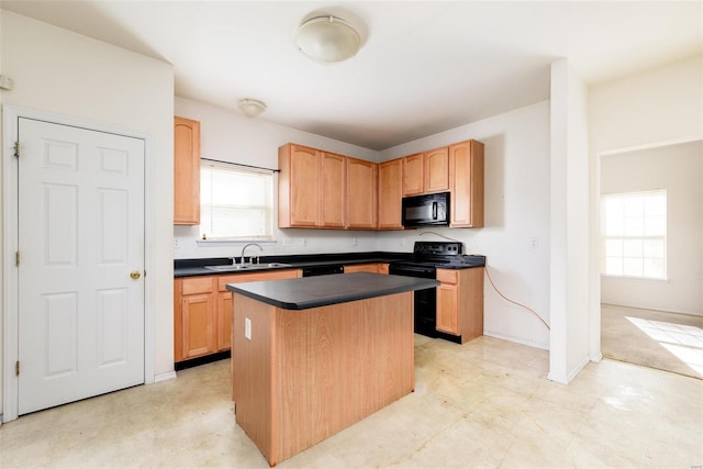 kitchen with black appliances, a center island, and sink