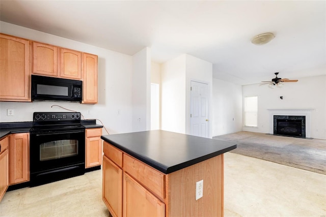 kitchen with light carpet, black appliances, ceiling fan, a fireplace, and a kitchen island