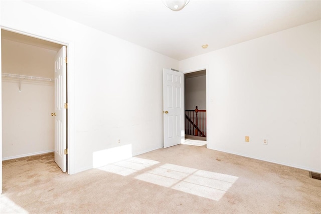 unfurnished bedroom featuring light colored carpet