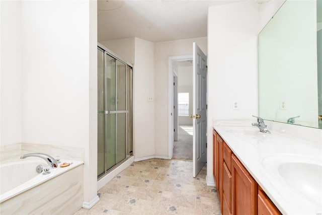 bathroom featuring vanity and separate shower and tub