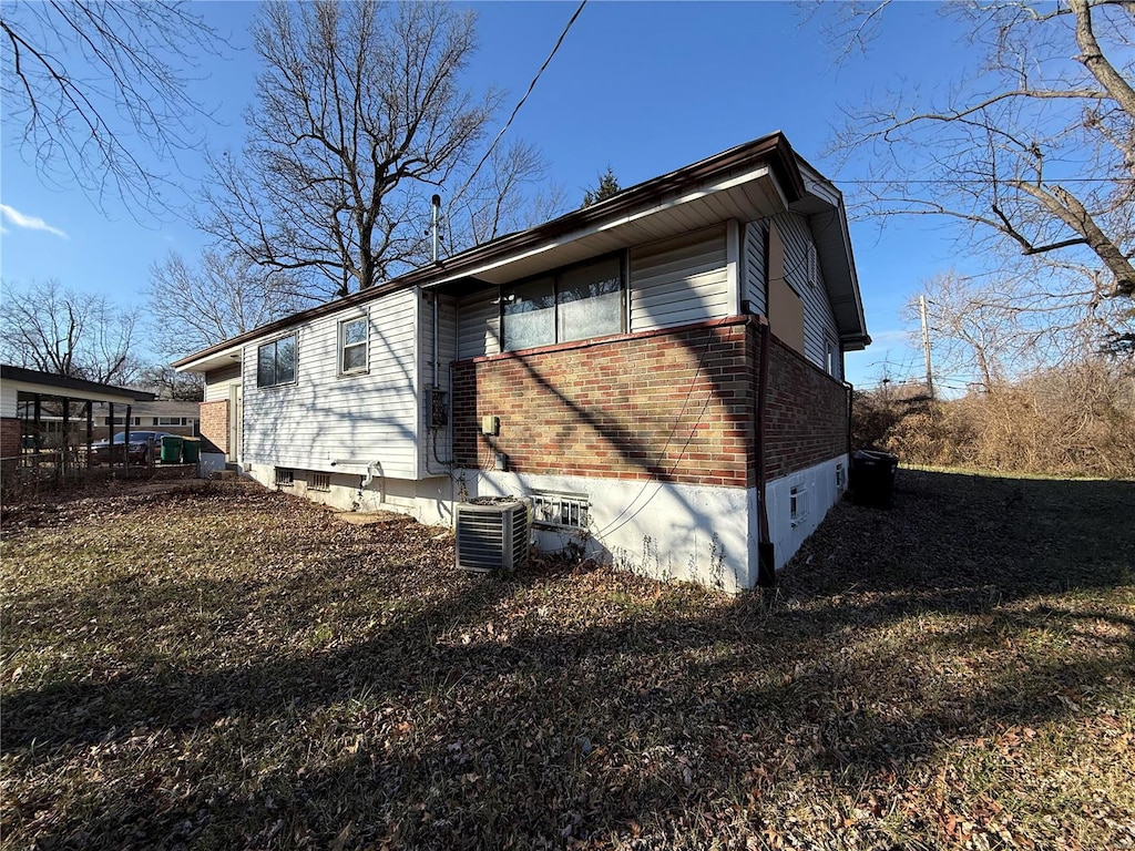 view of property exterior featuring central AC