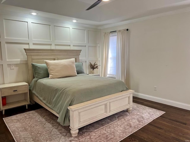 bedroom with ceiling fan, crown molding, and dark hardwood / wood-style floors