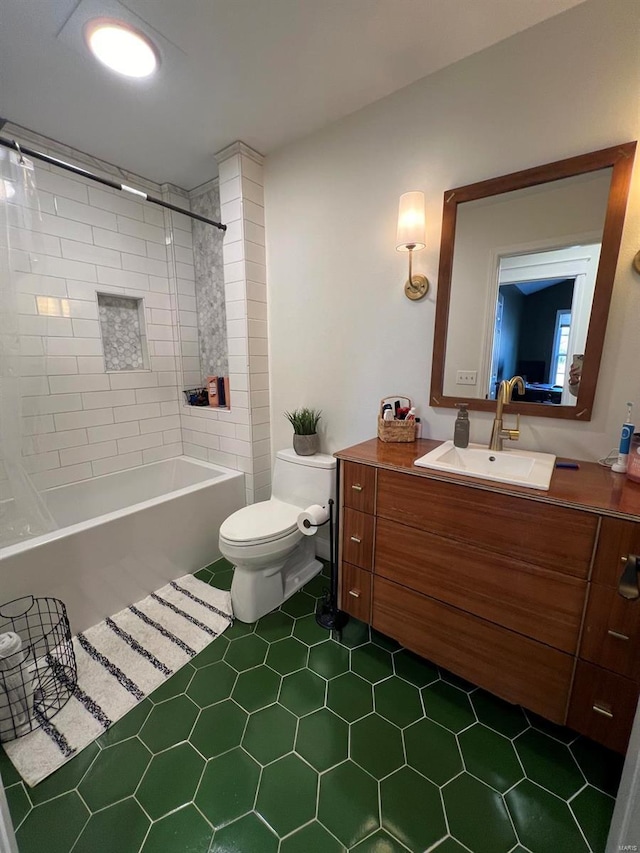 full bathroom with vanity, tile patterned floors, tiled shower / bath combo, and toilet