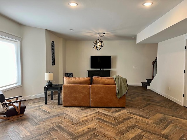 living room featuring parquet flooring