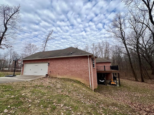 view of property exterior featuring a garage and a wooden deck