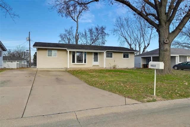 ranch-style home featuring a front yard