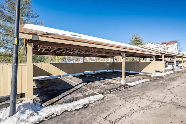 view of vehicle parking with a carport