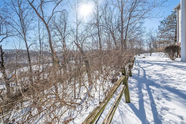 view of yard layered in snow